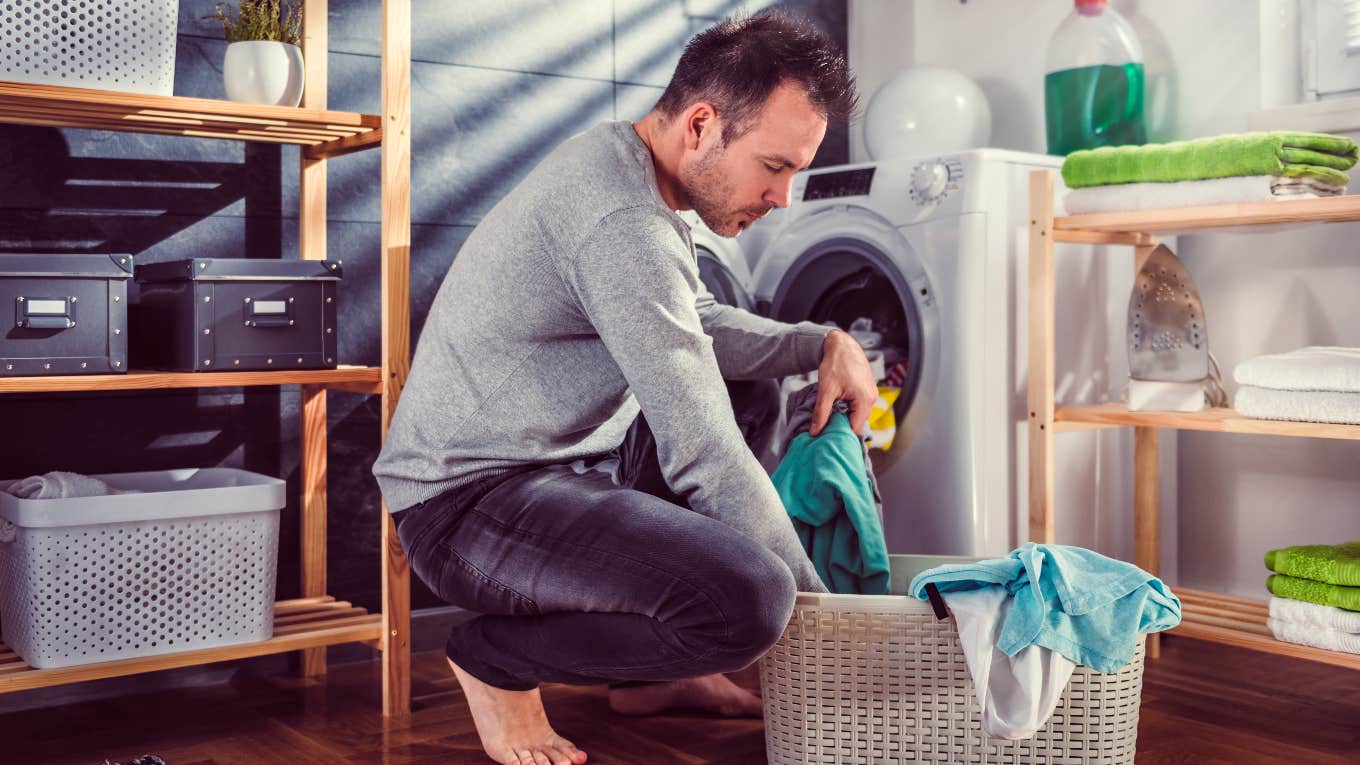 Man doing laundry with laundry detergent fiancée is allergic to