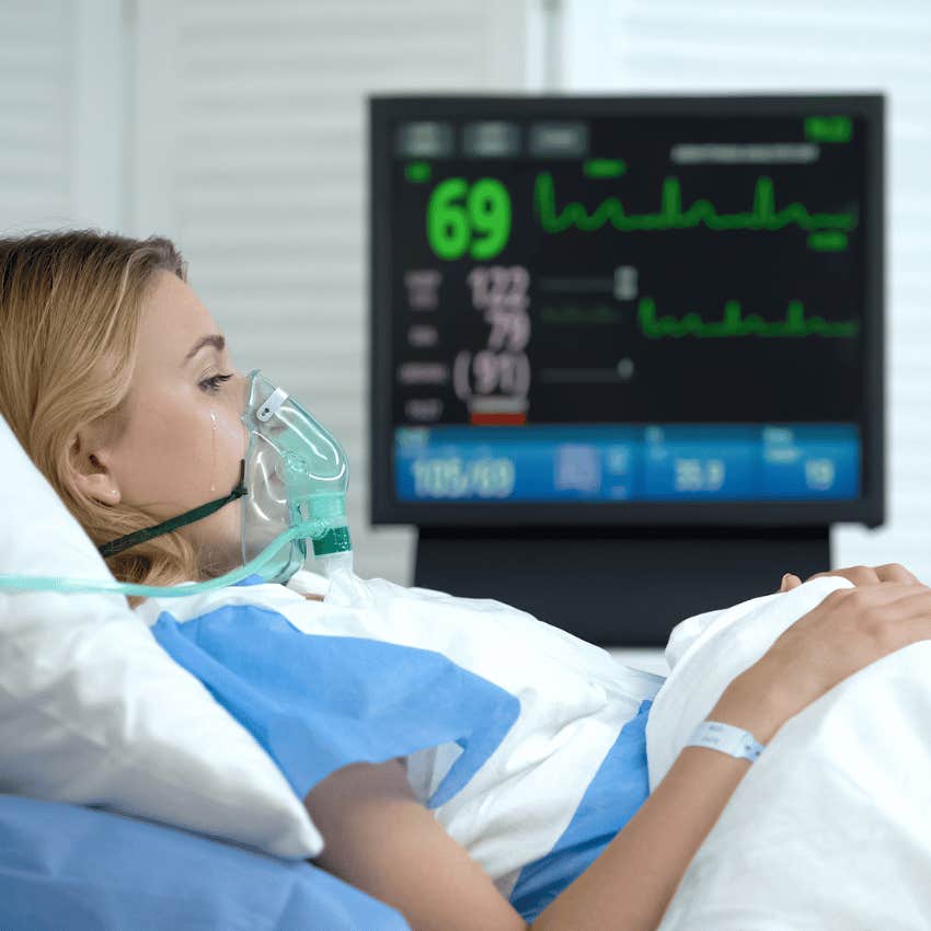 woman crying on hospital bed