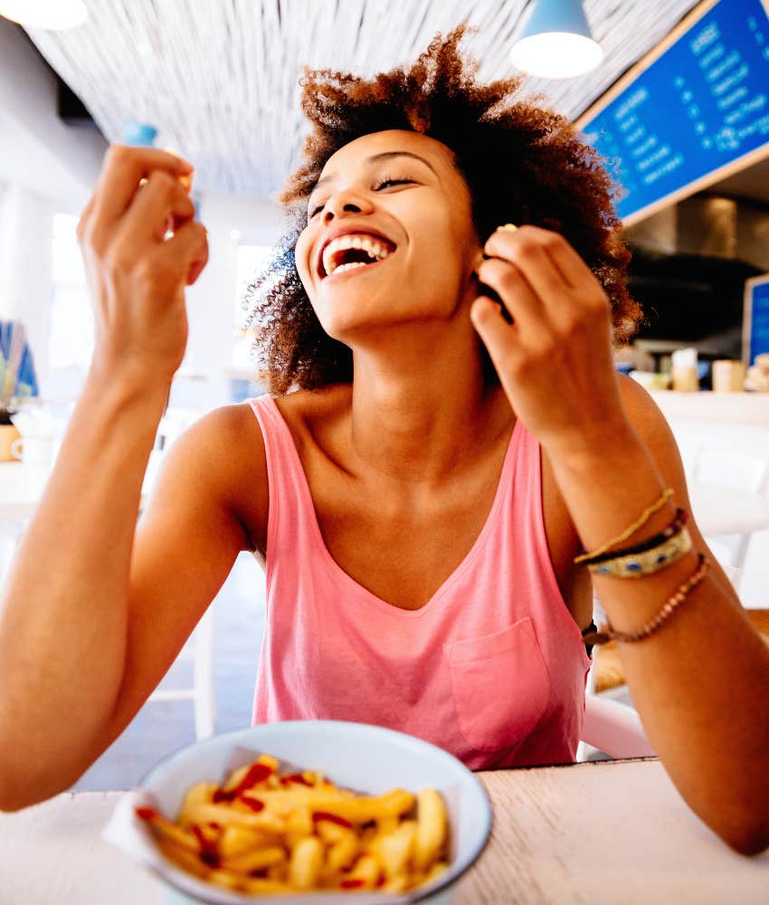 woman eating fries