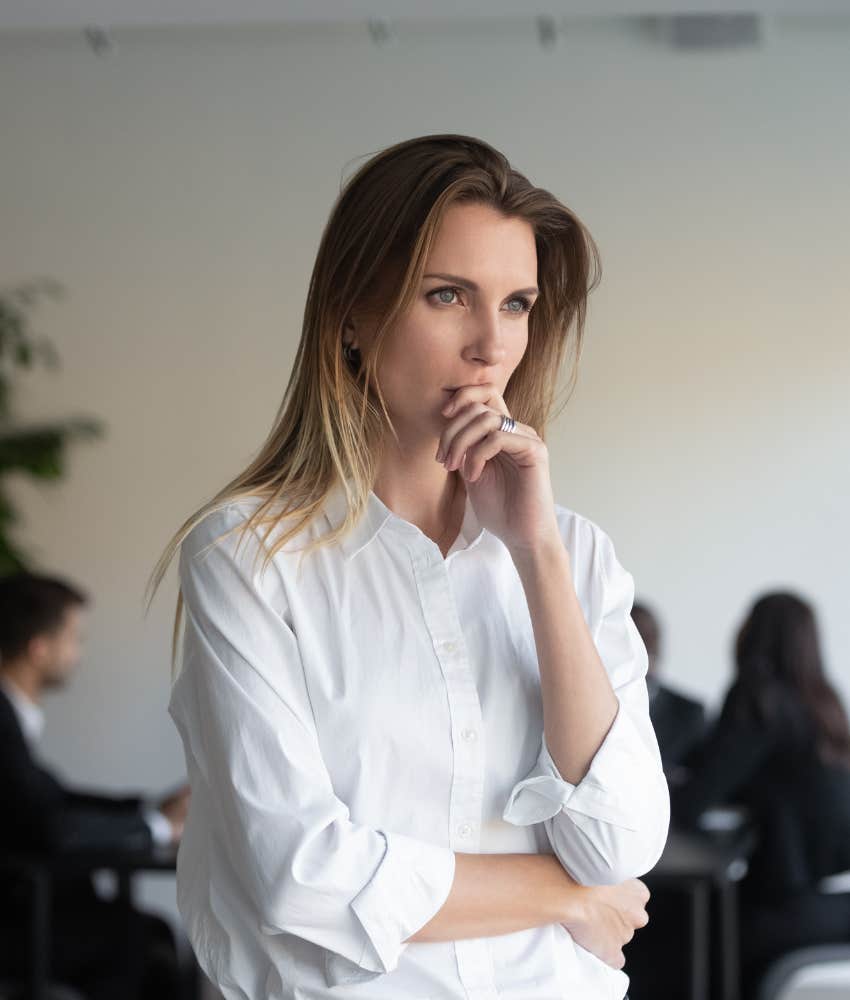 woman feeling conflicted at work