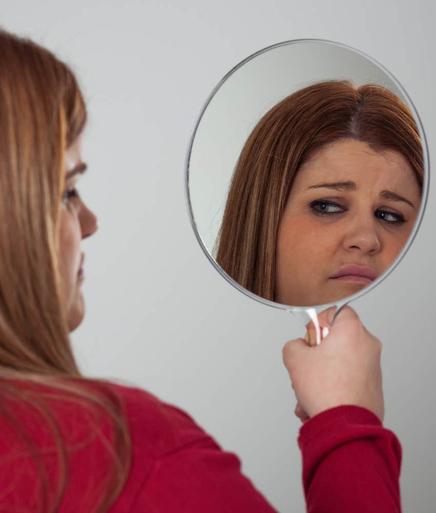 Woman feeling unhappy with her appearance