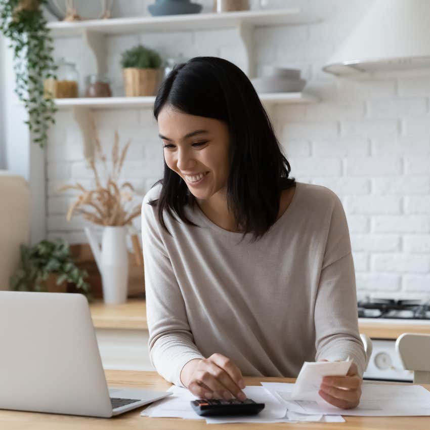 Happy woman with good savings about to buy a house