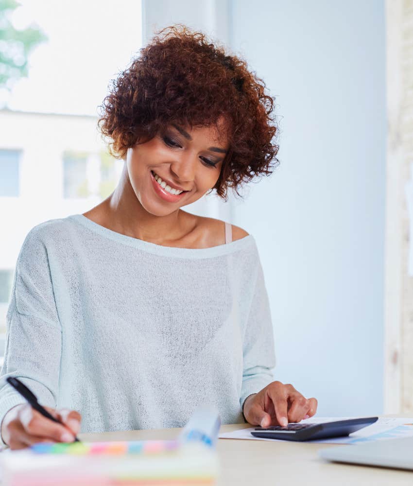 woman happy with her finances