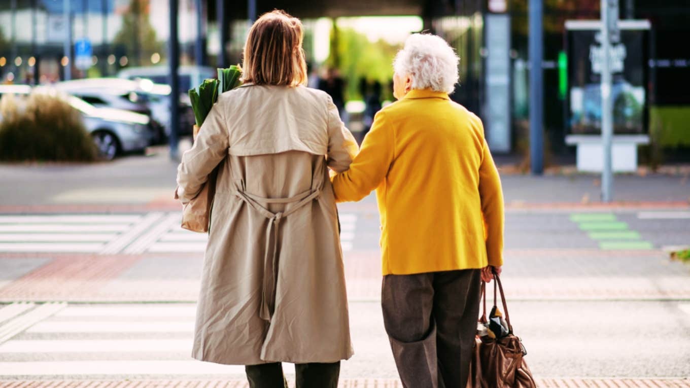 woman and grandma walking on street 