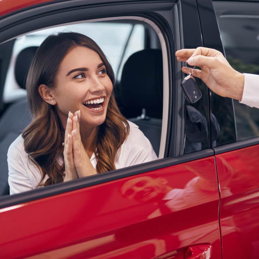 woman in car dealership 