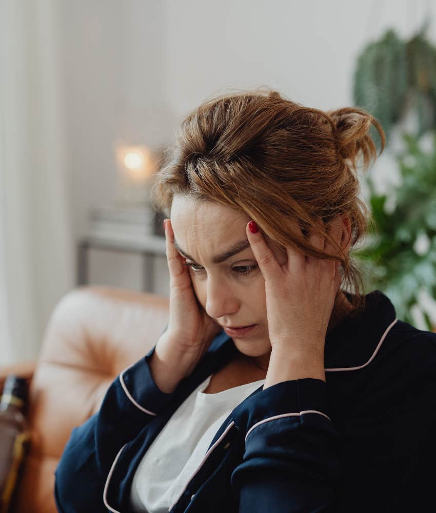 woman stressed out with hands on head