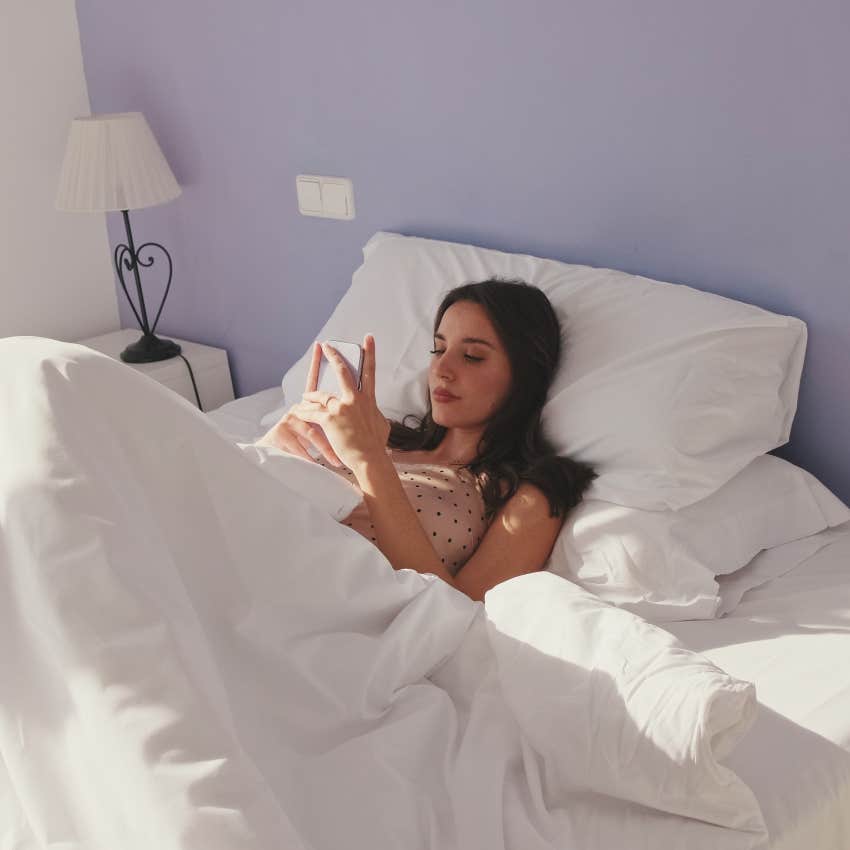 woman with morning anxiety on her phone