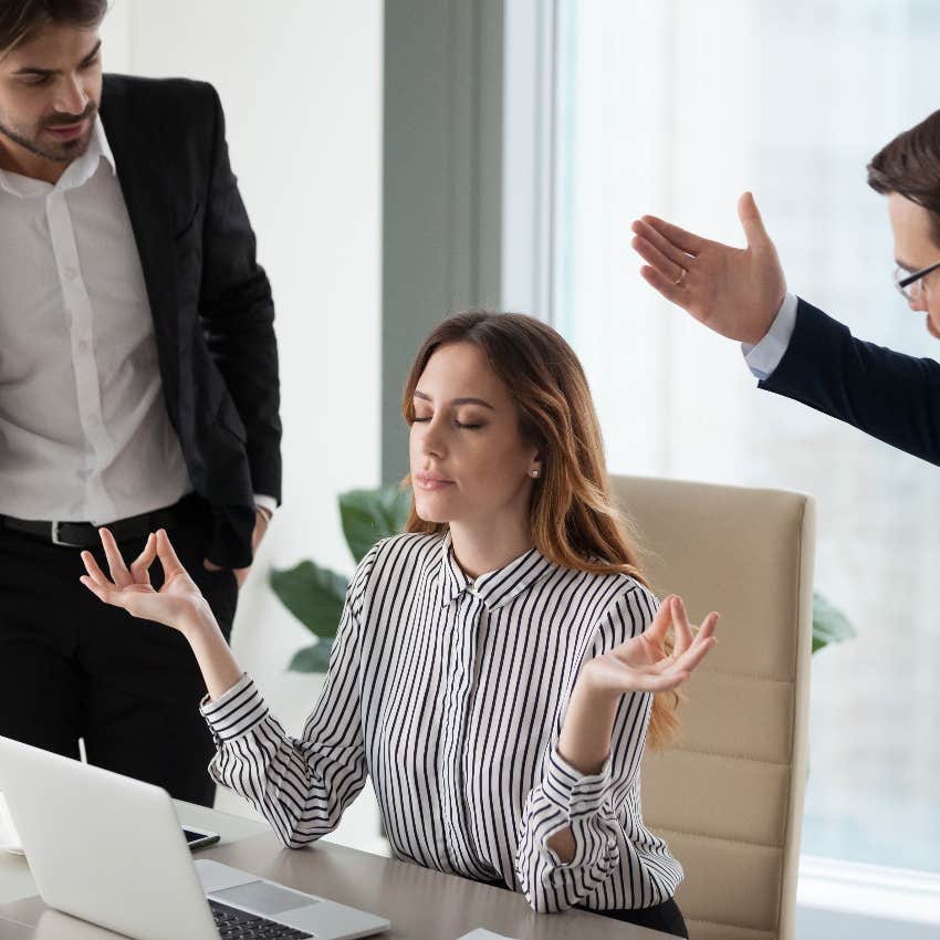 Woman staying calm and managing her reaction to mean coworkers