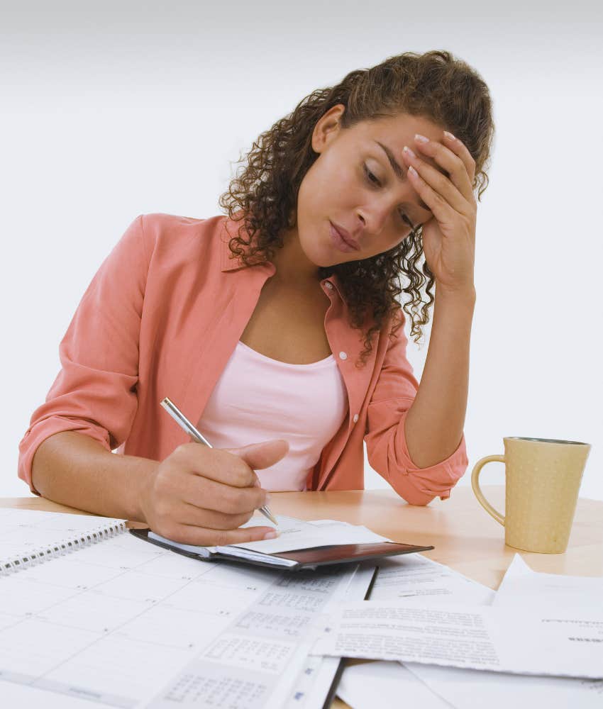 woman stressed about finances and bills