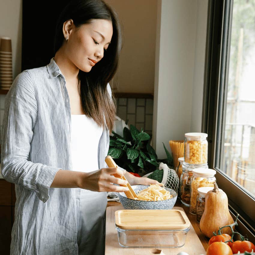 woman with a bowl of pasta noodles