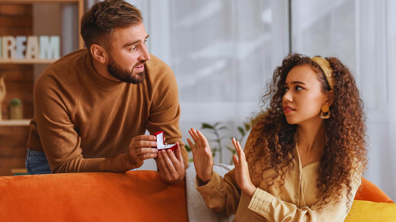 Woman physically rejects mans proposal.