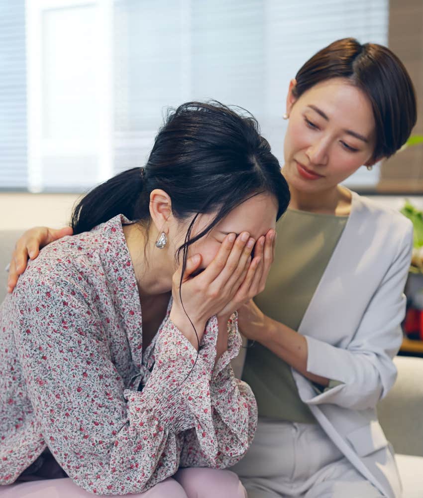 woman comforting her crying boss