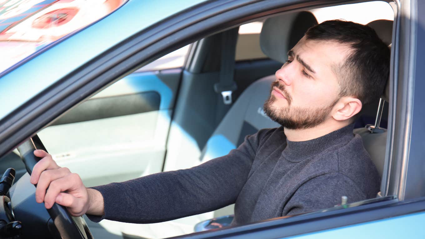 Manager pulling up to work in the car he is living out of