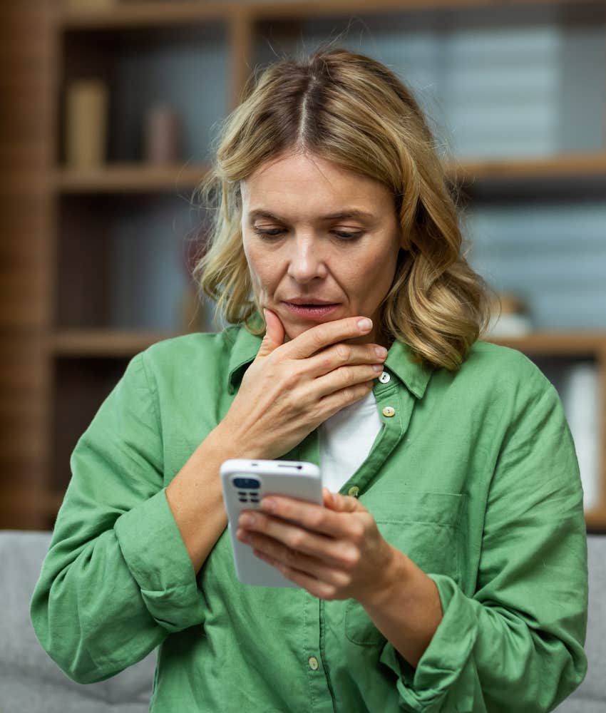 worried mom looking at her phone