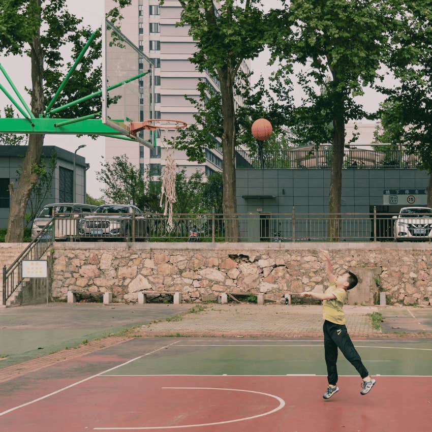 young boy playing basketball