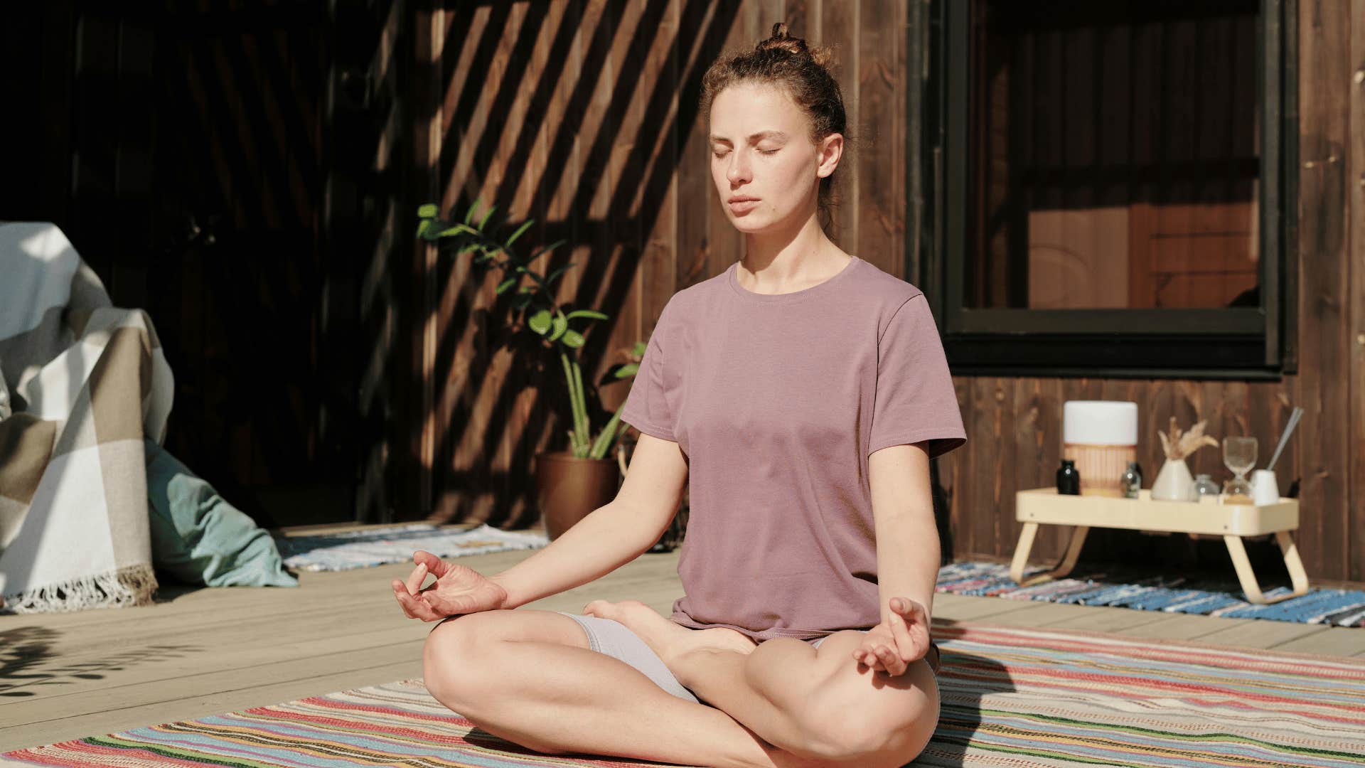 young woman meditating outdoors