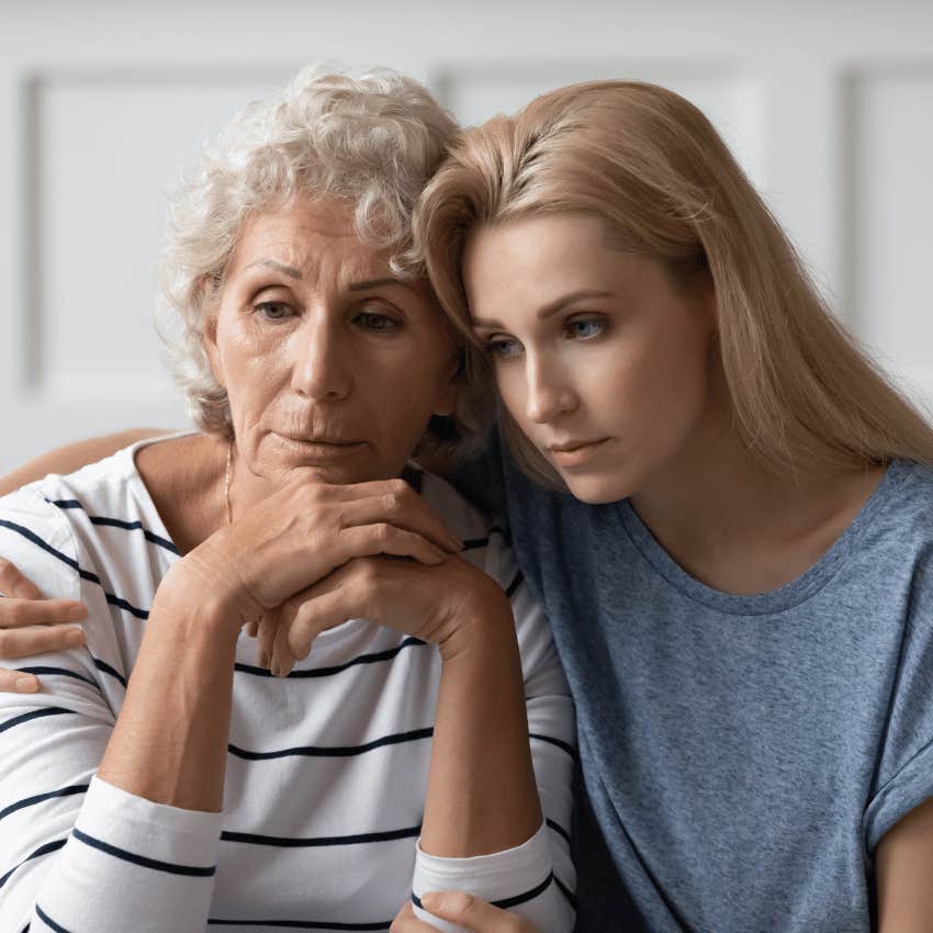 younger woman comforting an older woman