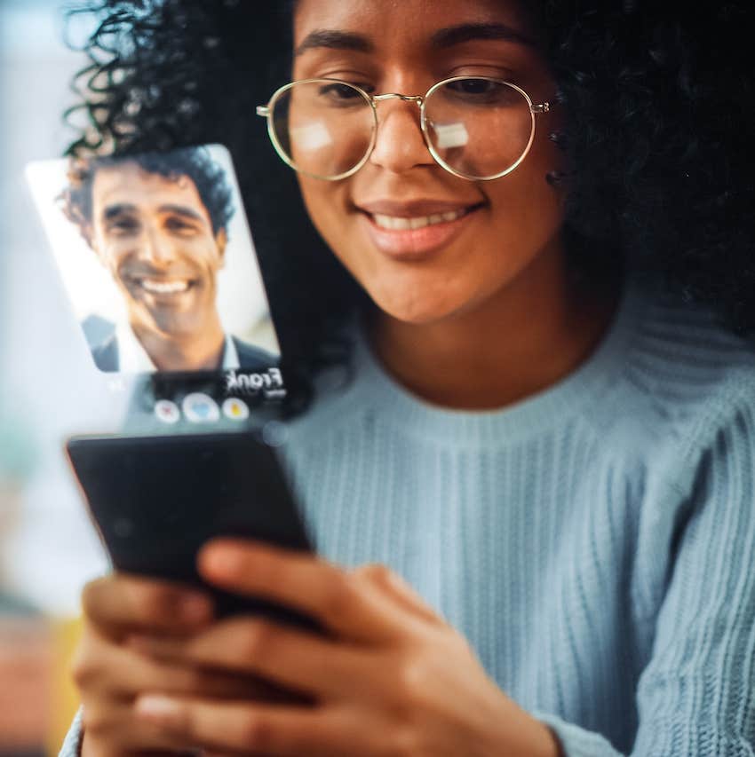 Happy woman gets a video call from a smiling guy