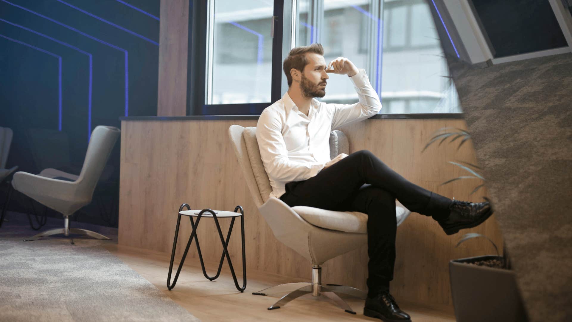 professional man looking out of window