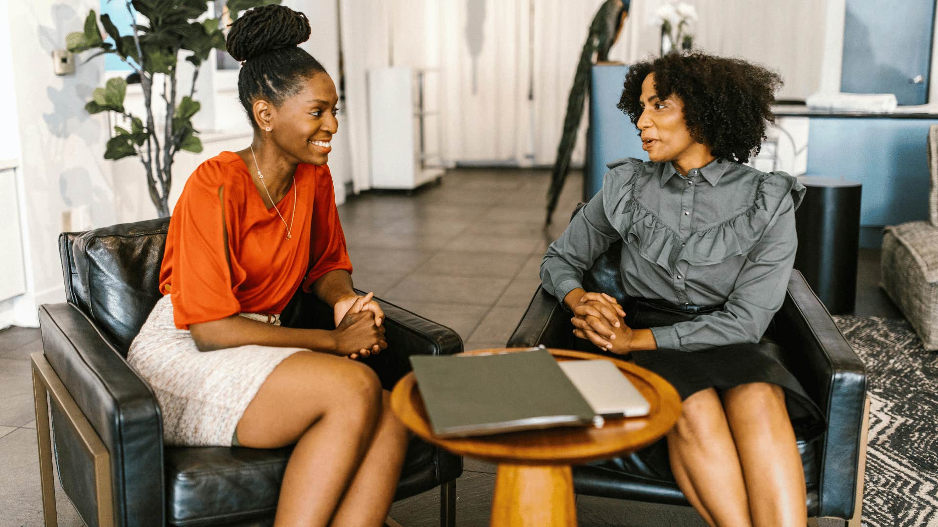 two professional woman having a conversation