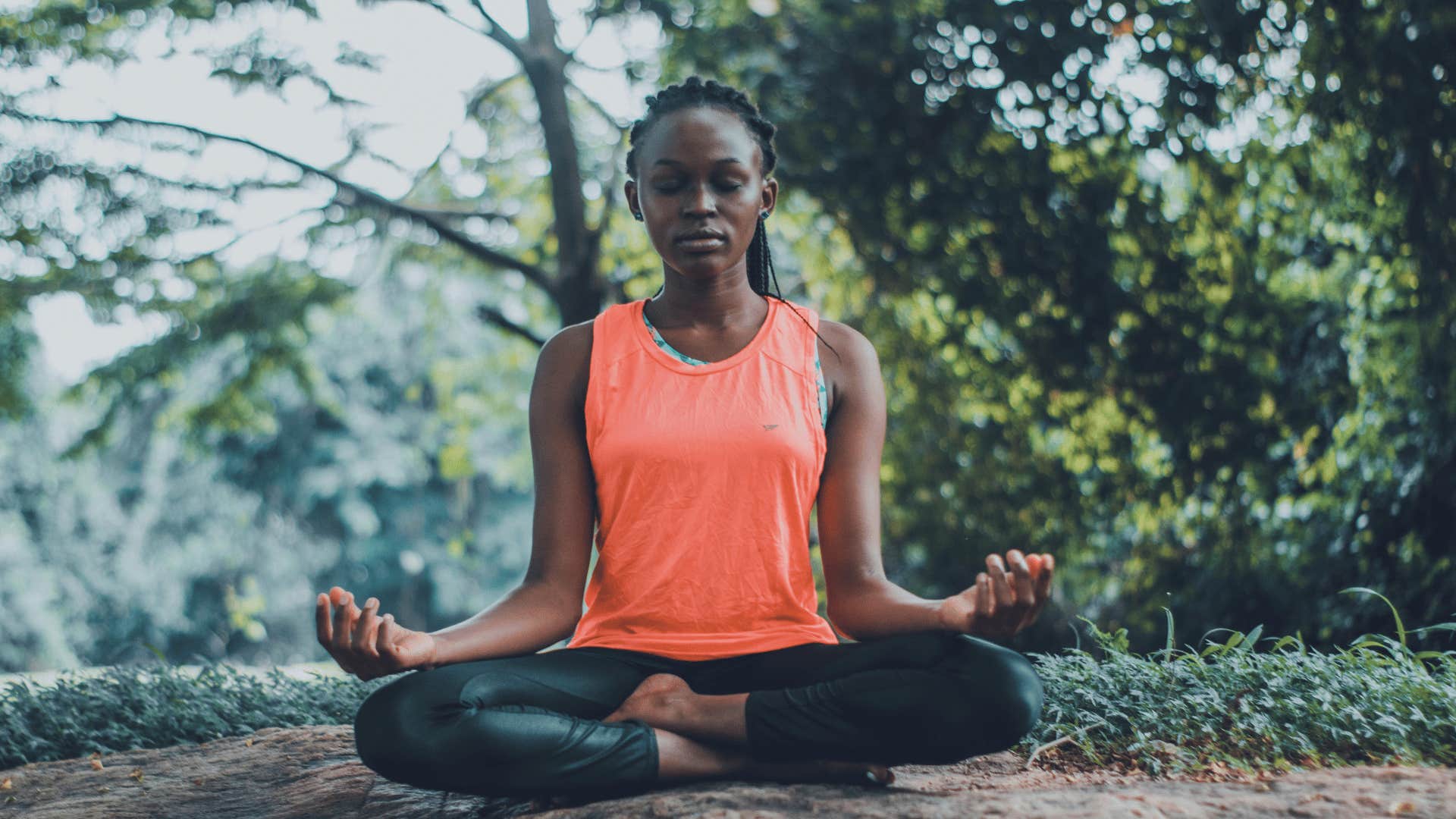 woman meditating outdoors