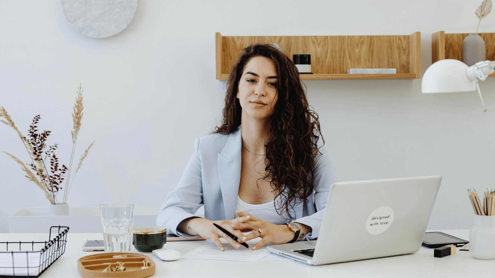 young businesswoman sitting behind a desk