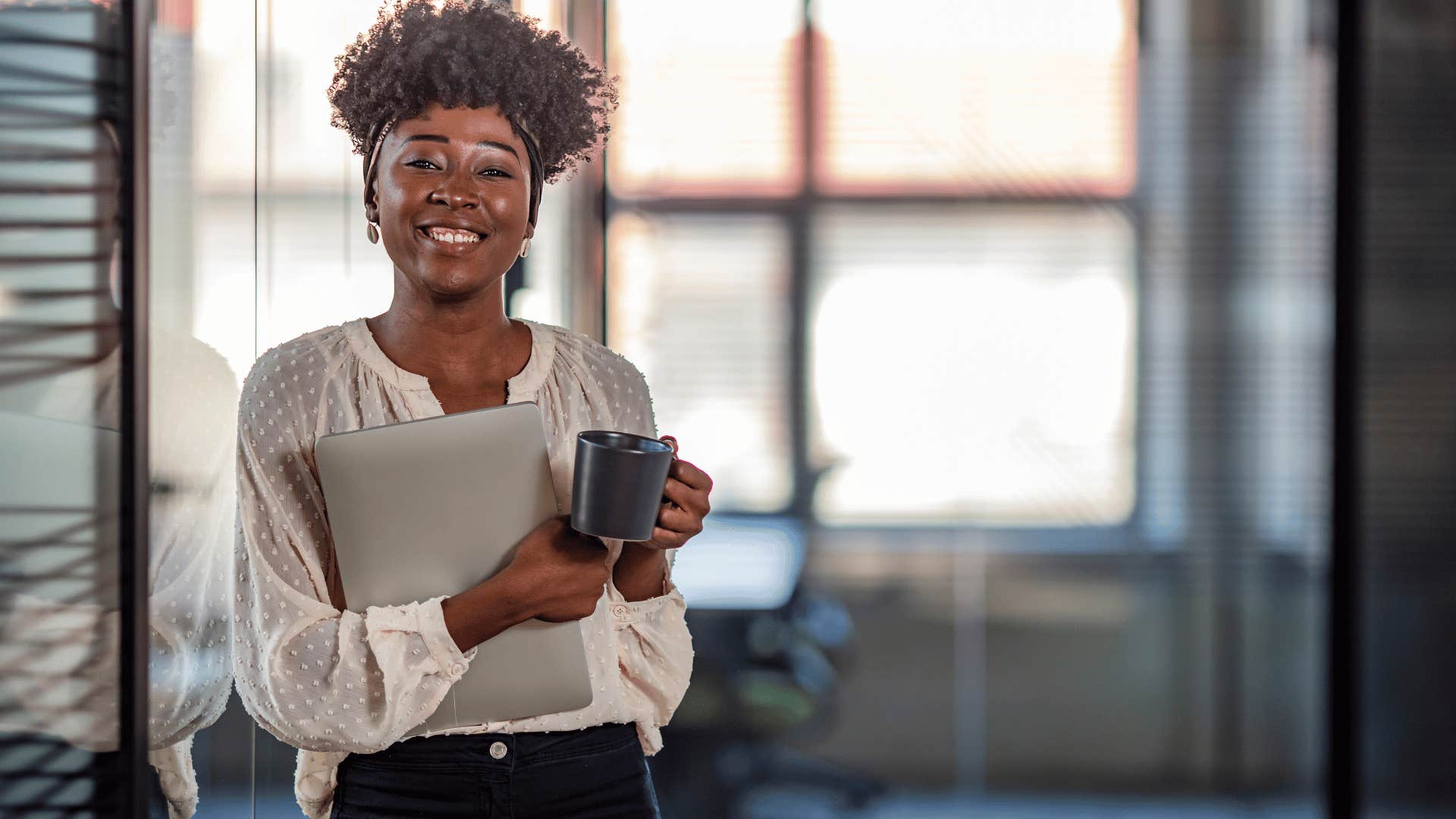 professional young woman holding a mug