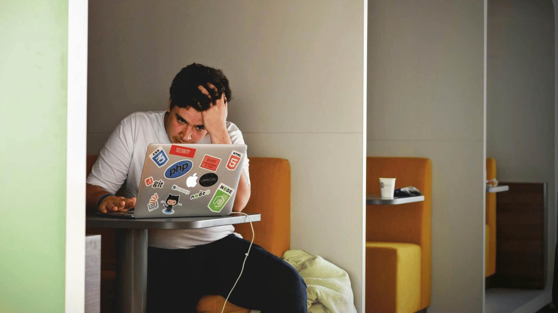 young man working on a laptop