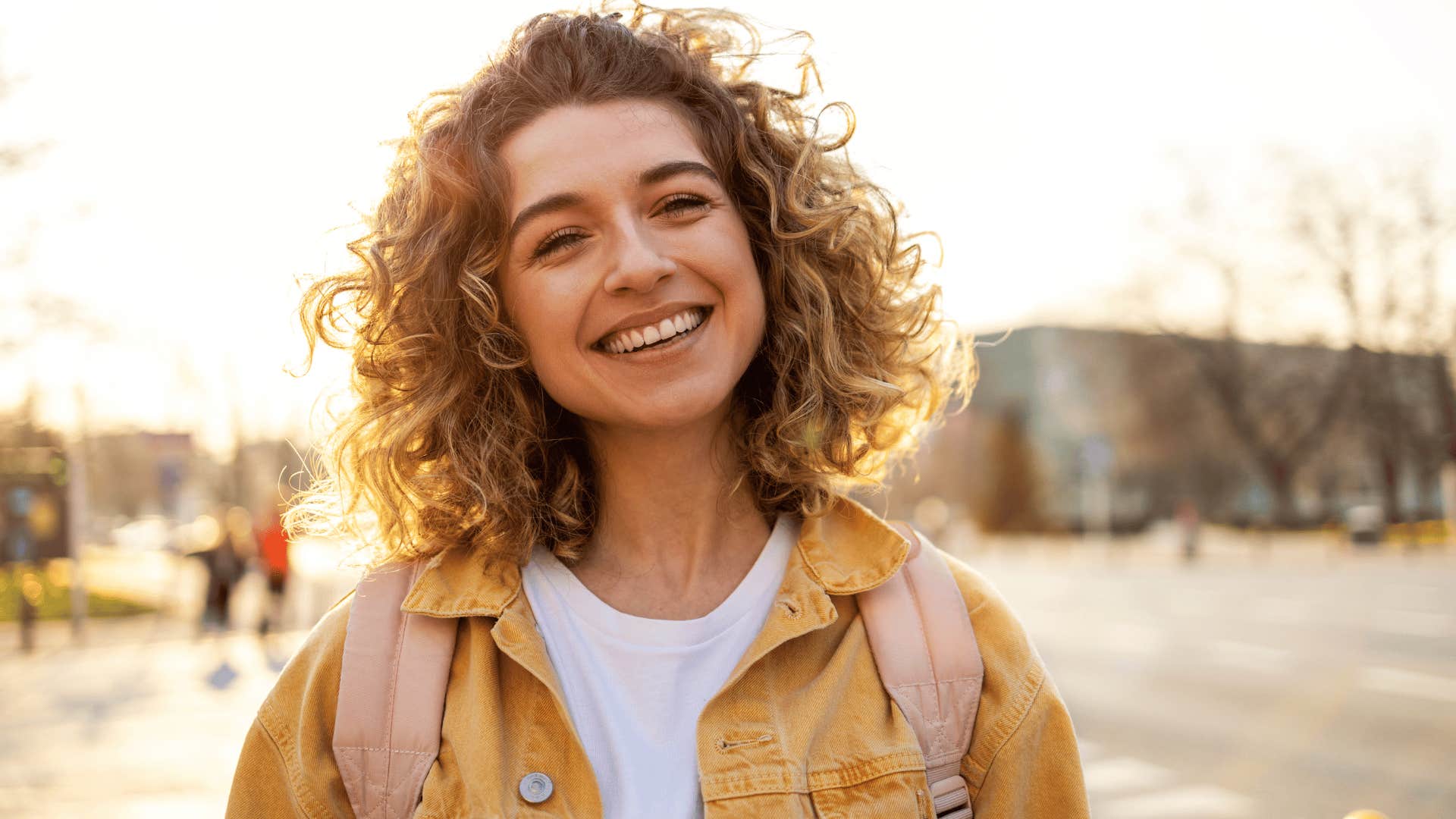 smiling young woman with curly hair