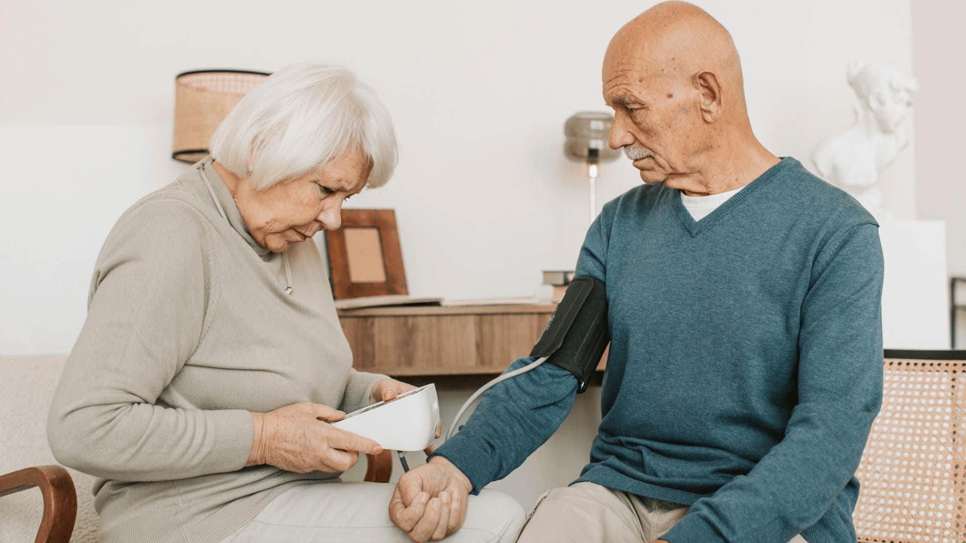 woman helping to take blood pressure