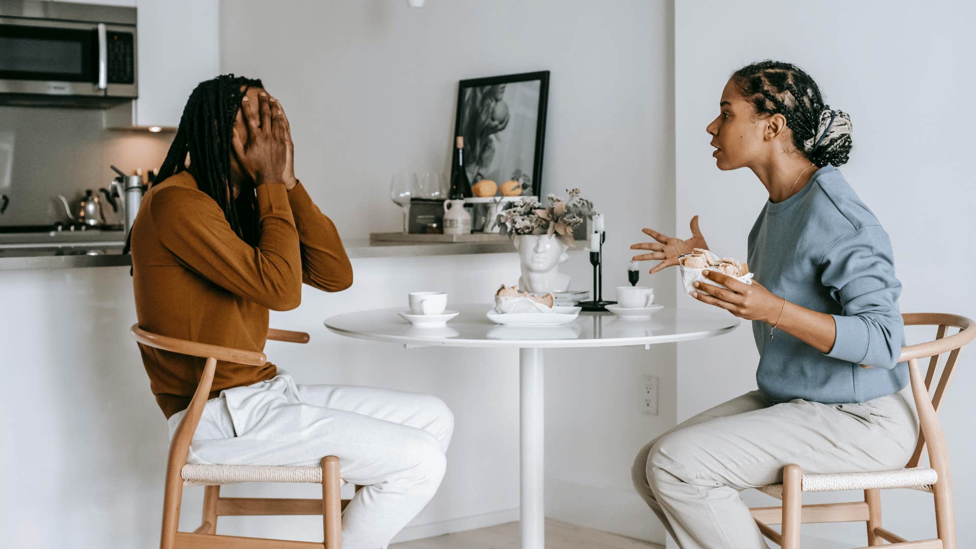 couple having a tense conversation at a round table