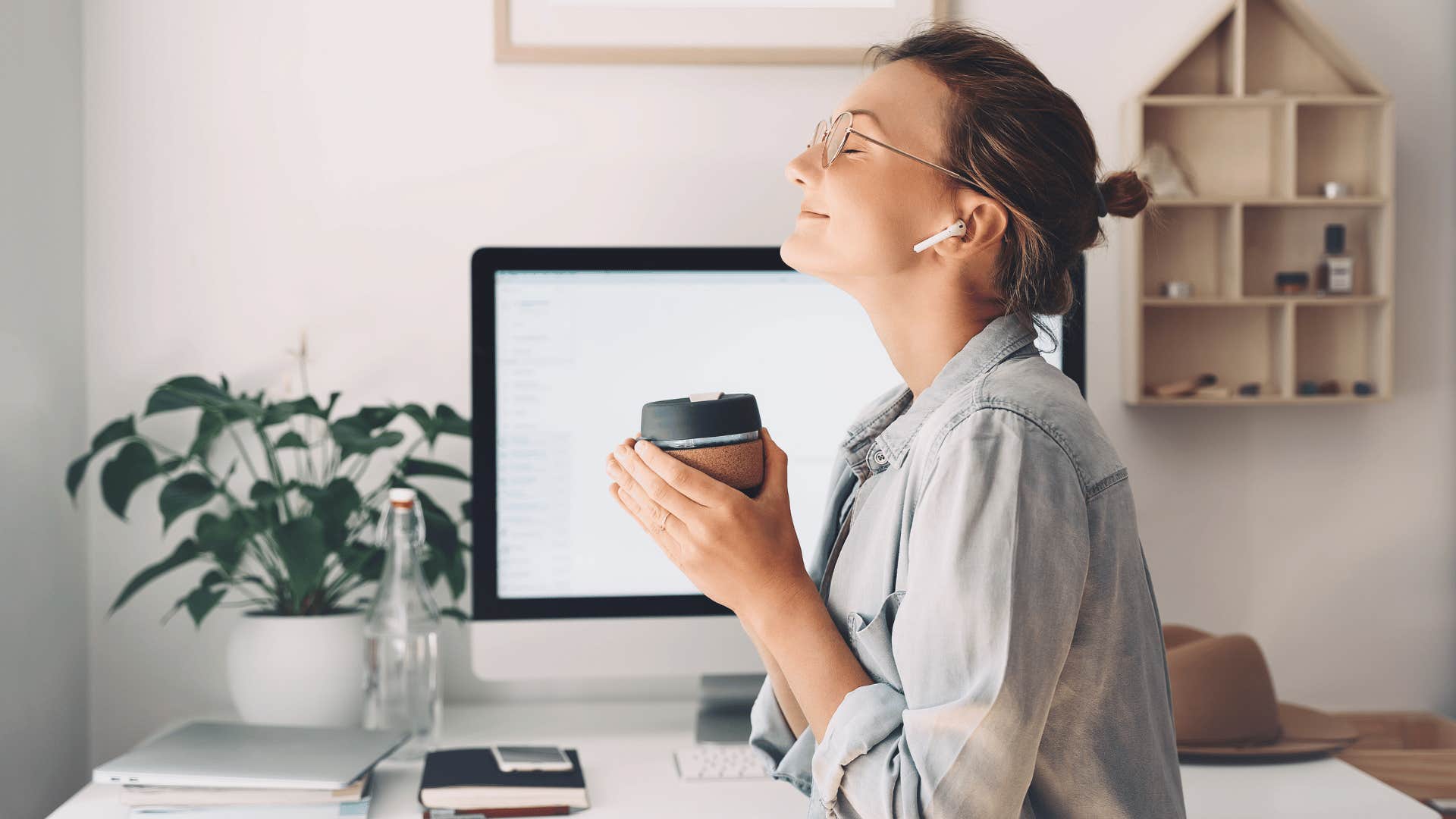 woman closing eyes in contentment