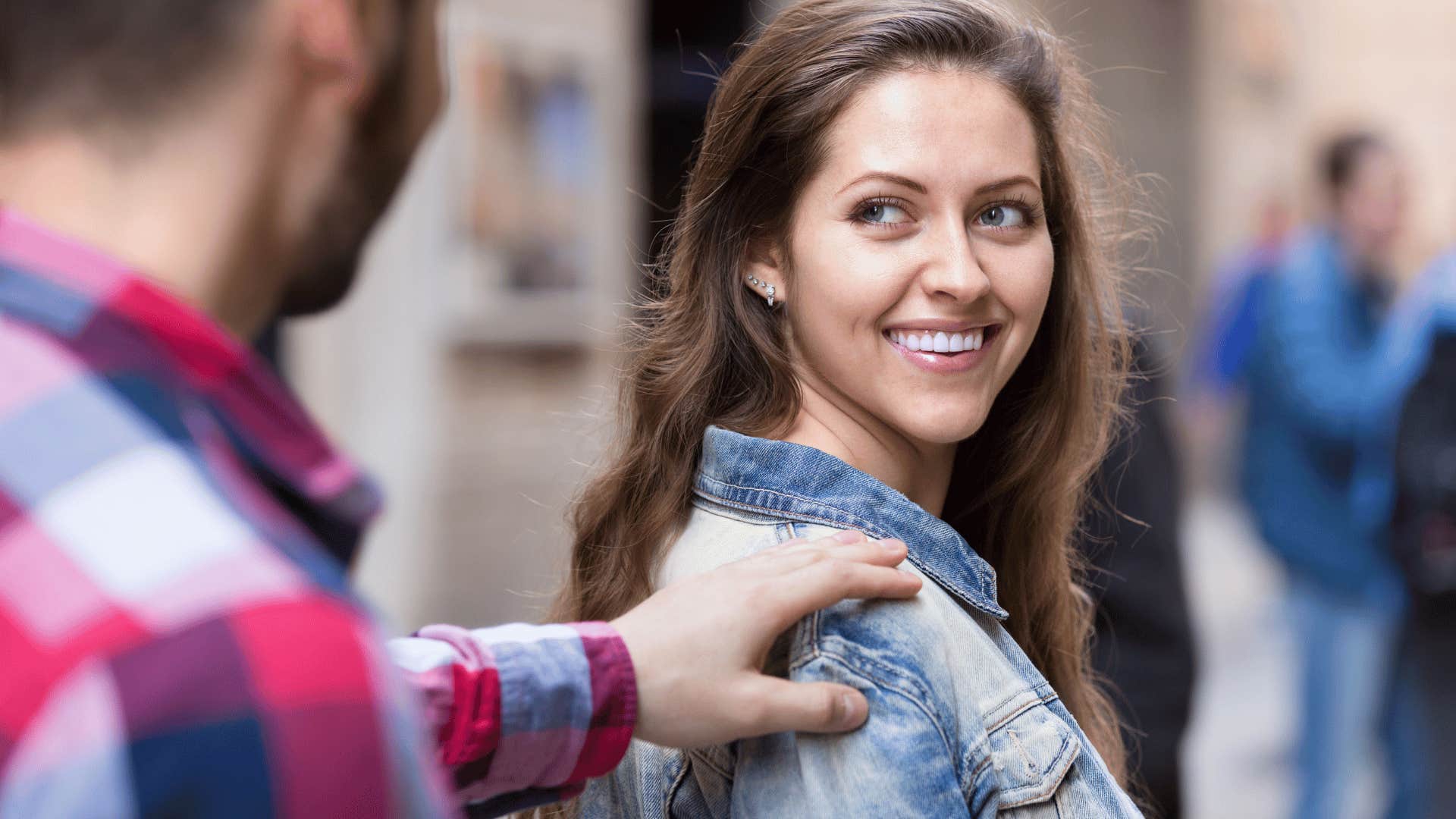 woman smiling back toward man