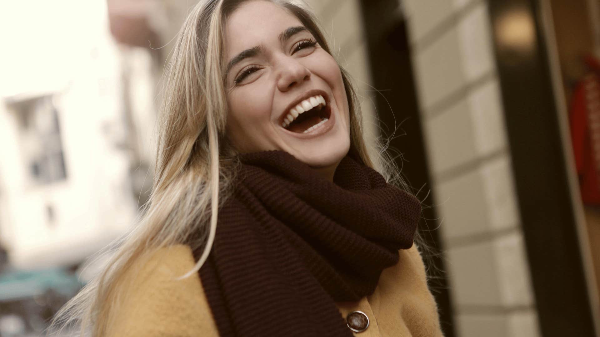 joyful young woman laughing