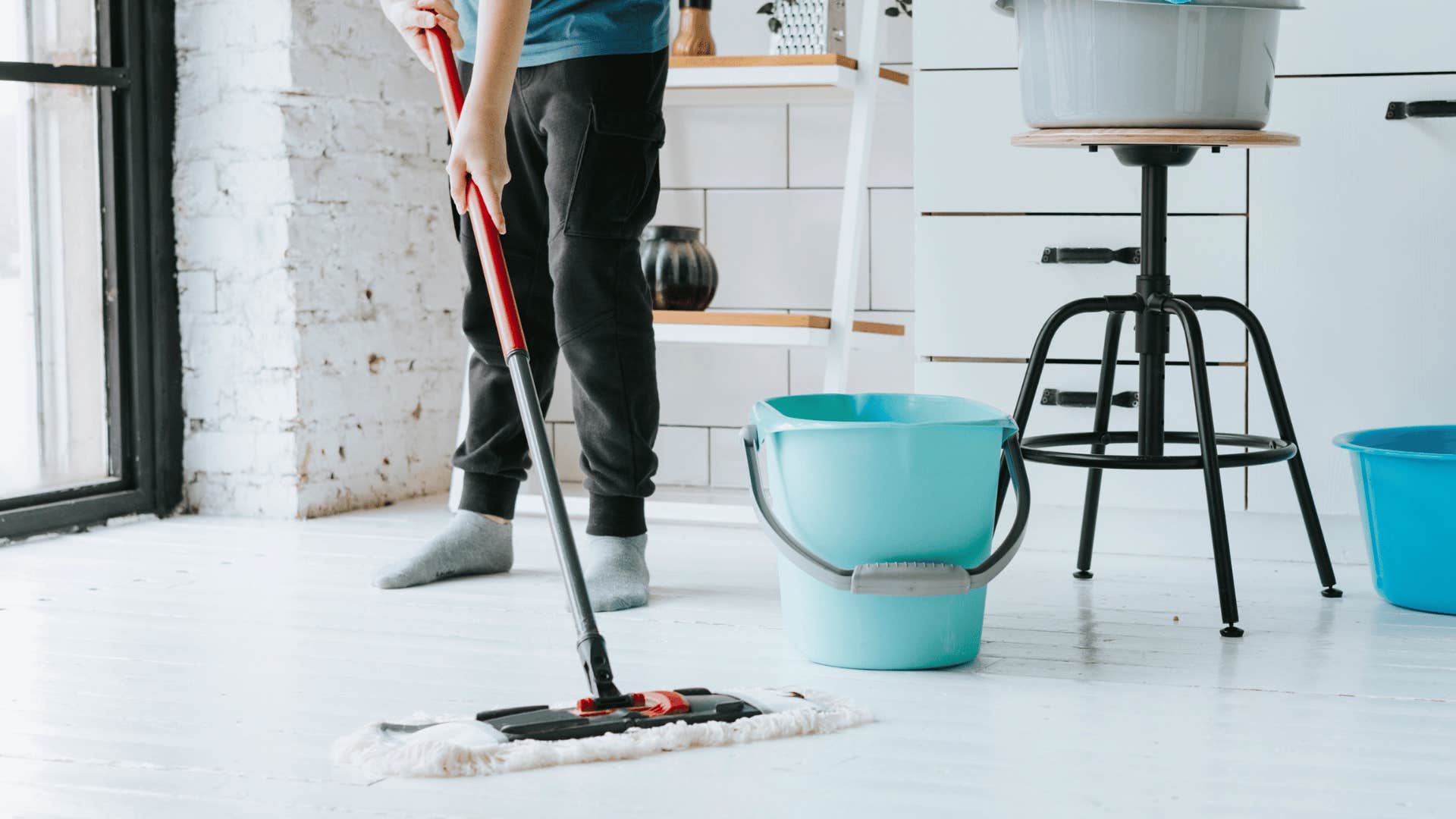 man mopping the floor