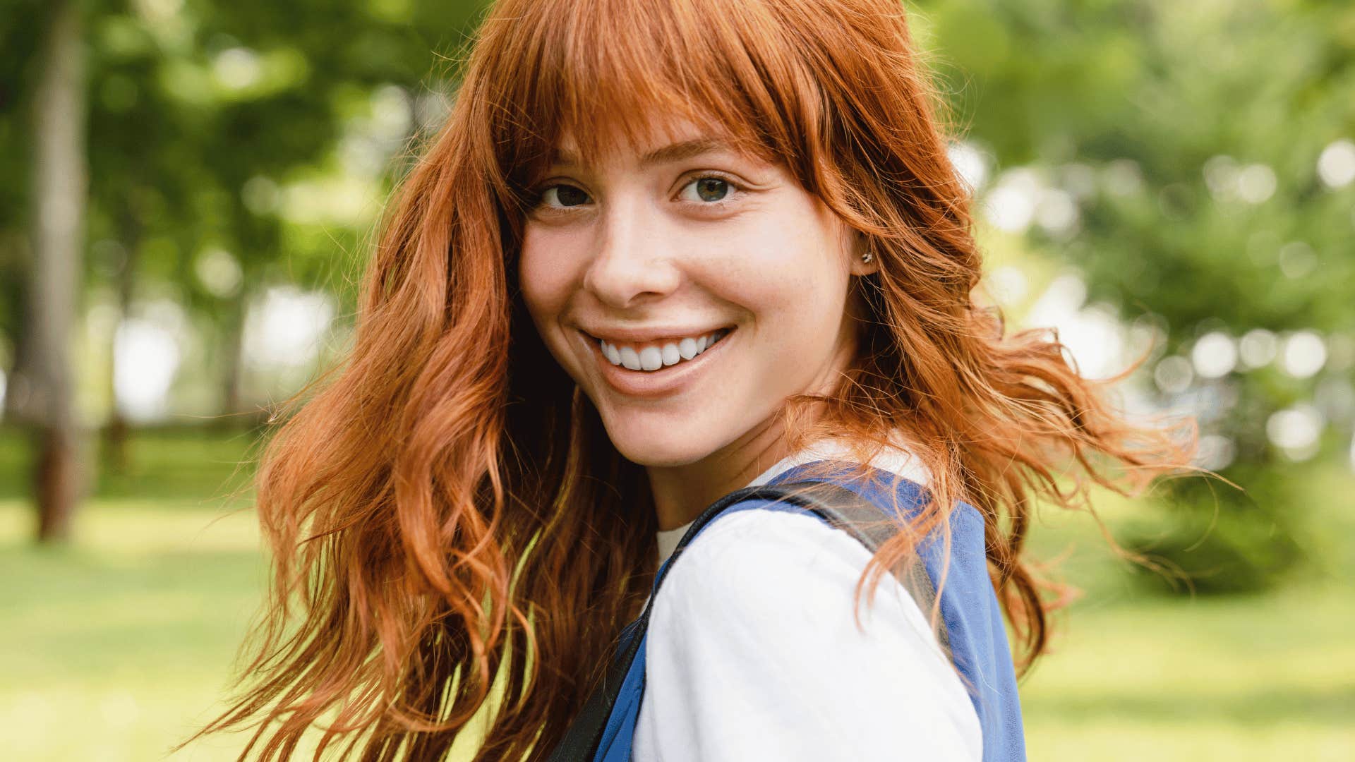 smiling woman with red hair