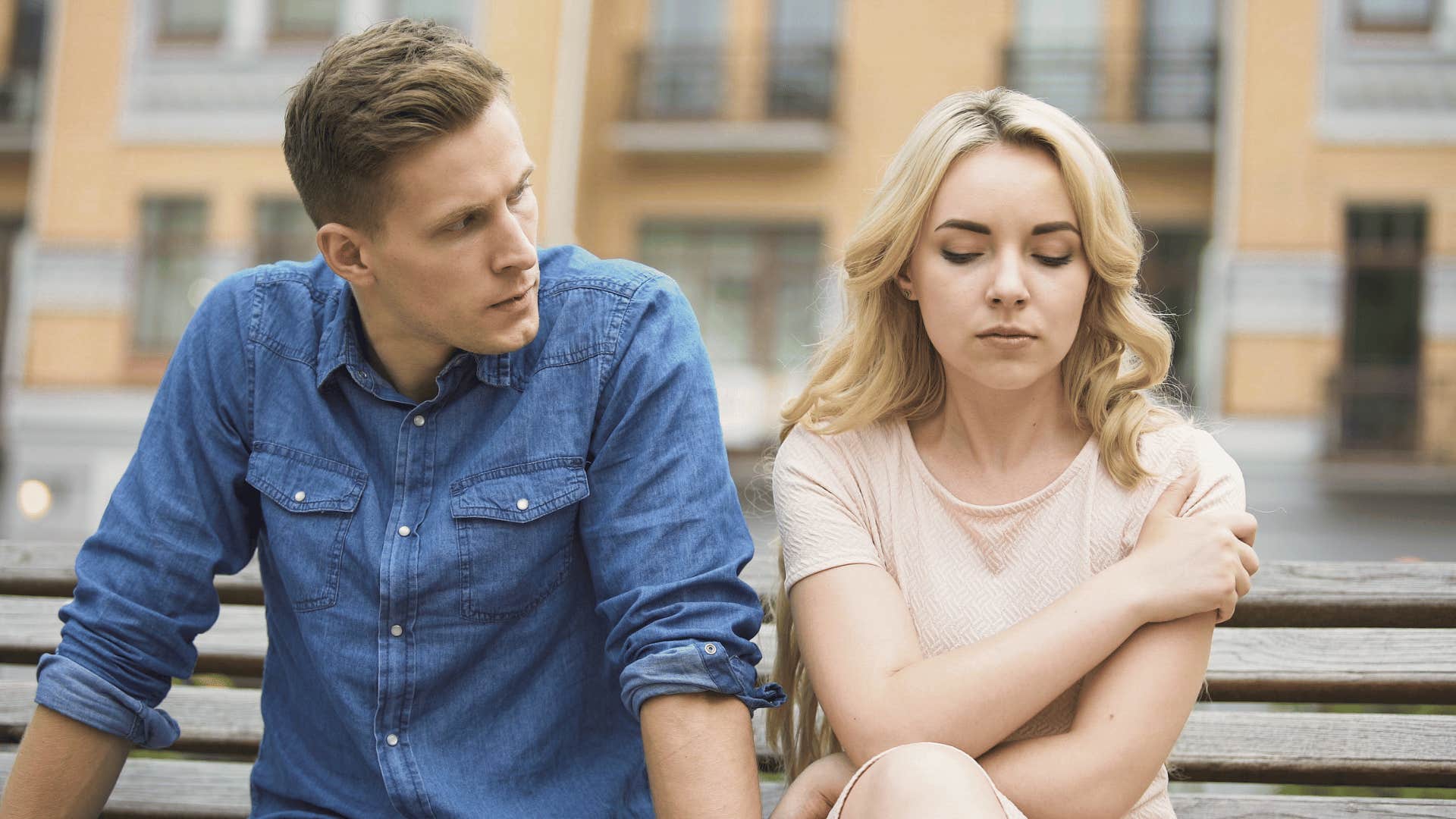 frustrated man looking at upset woman