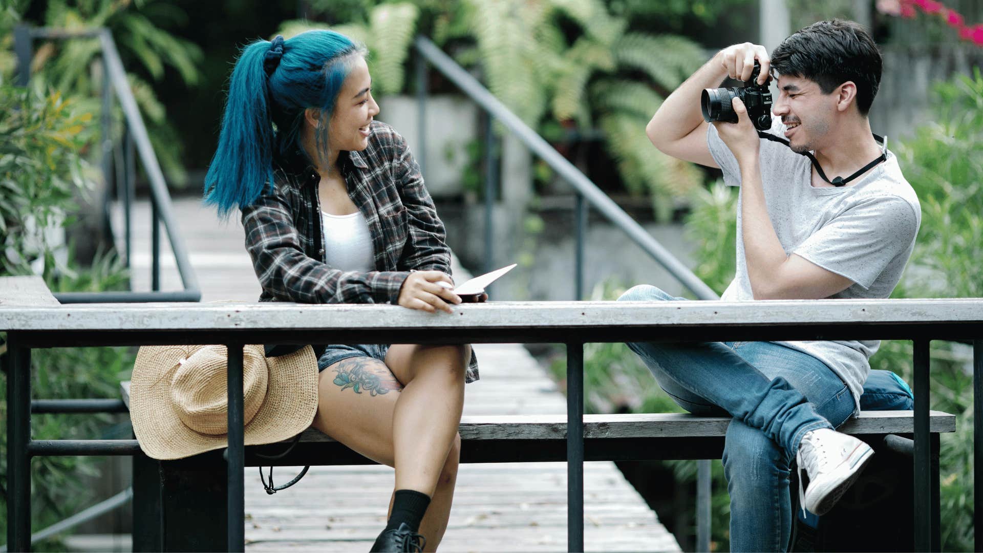 young man taking photo of young woman