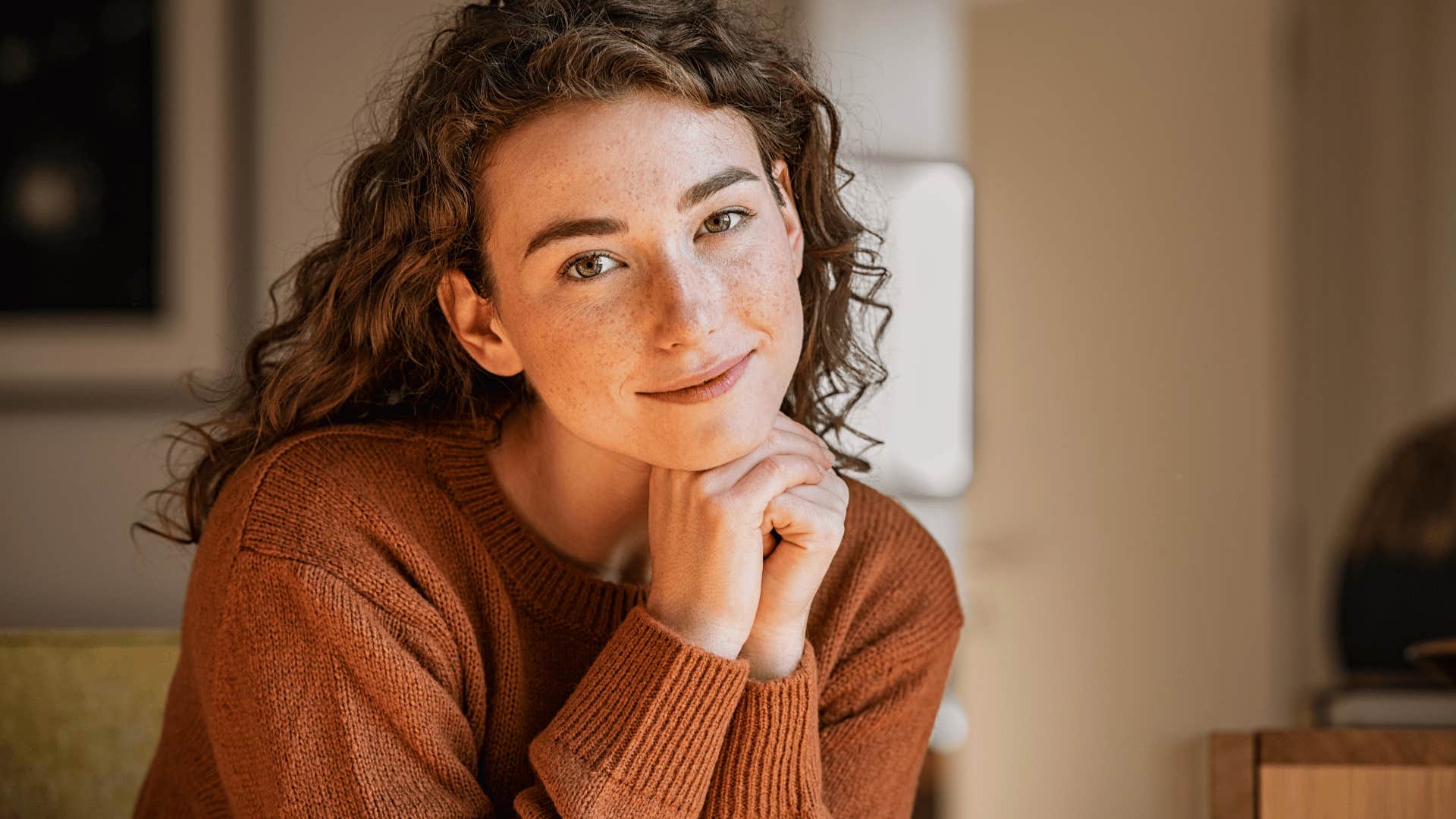 young woman smiling gently