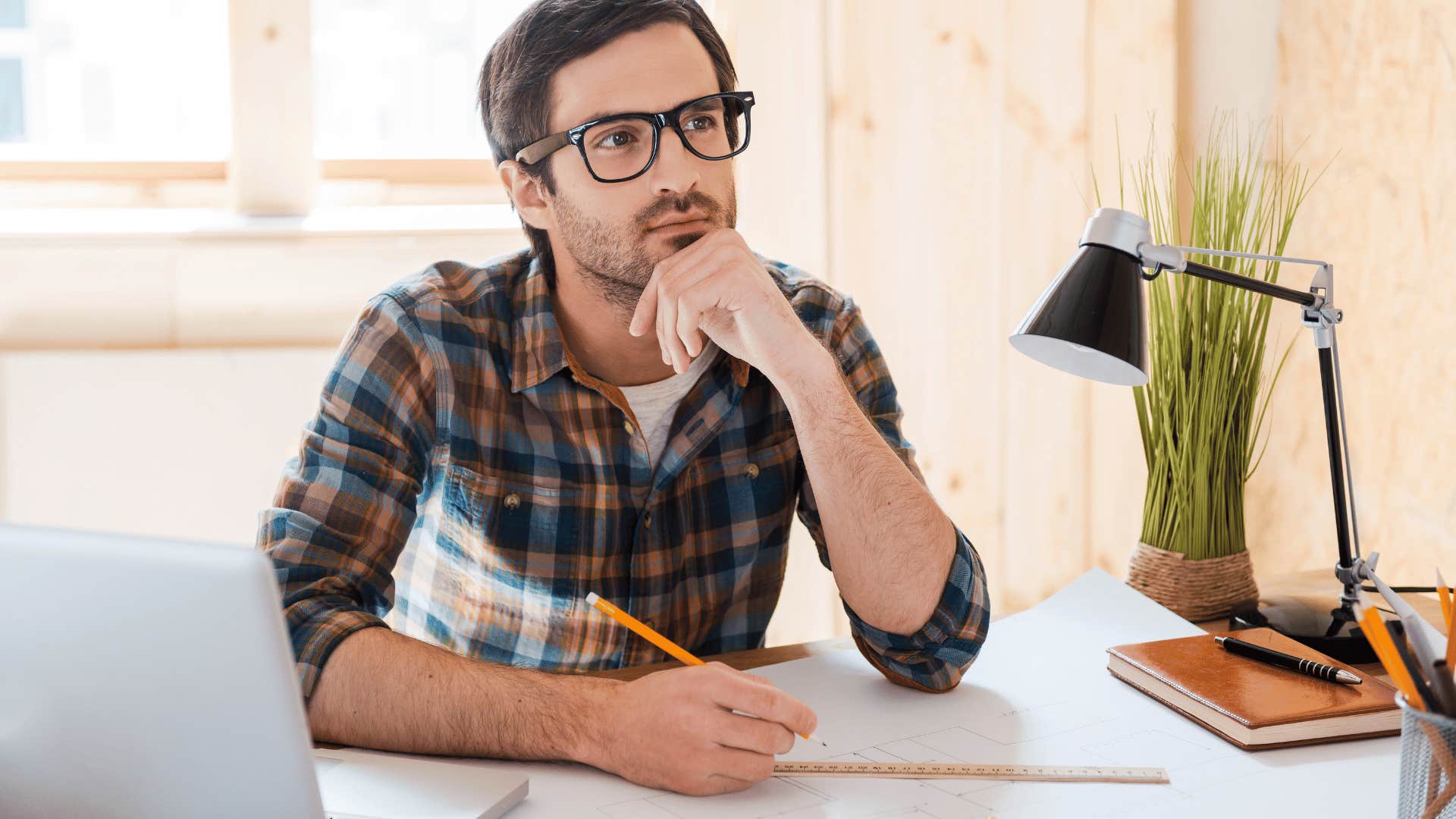 thoughtful young man waiting for inspiration