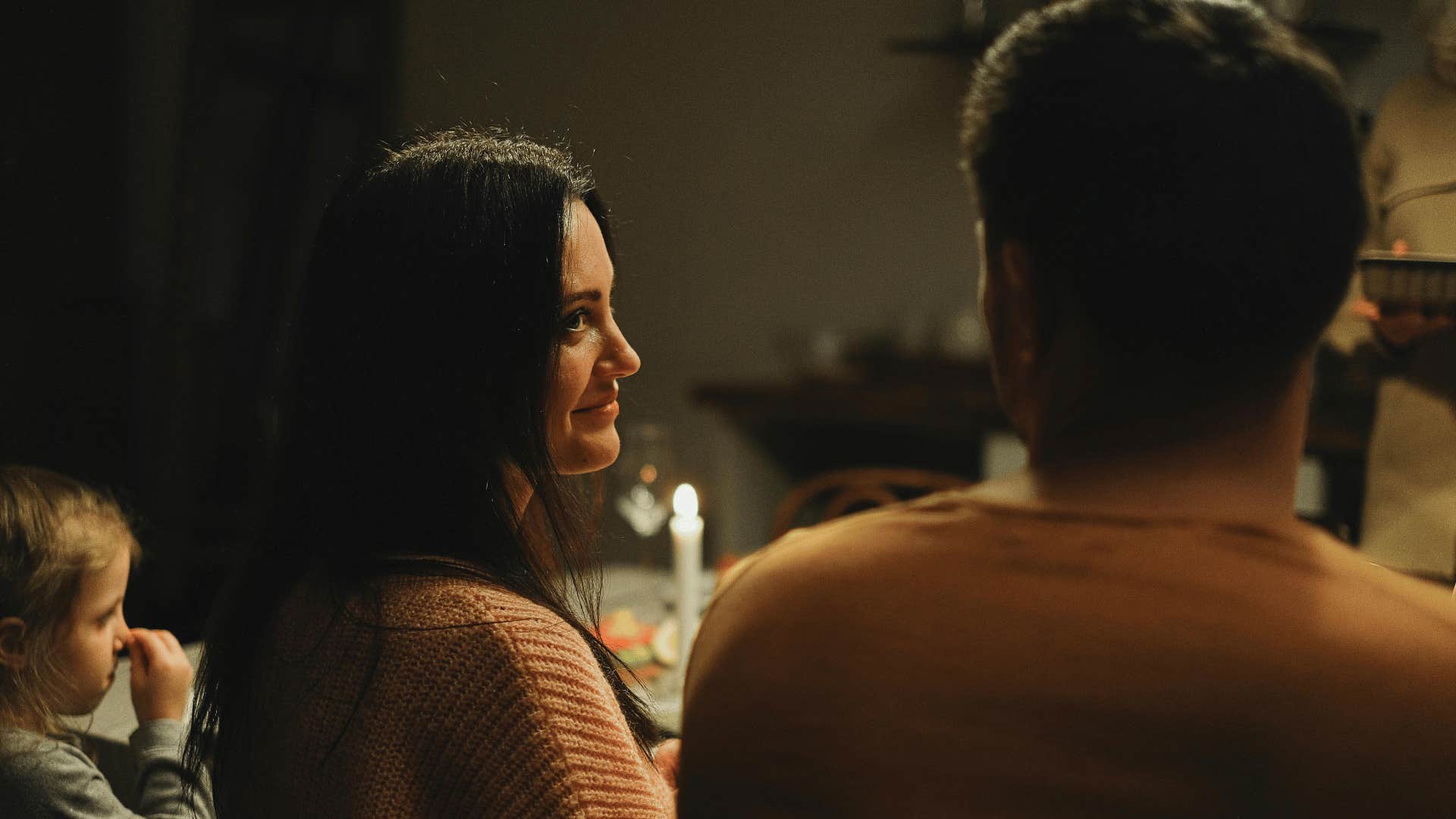 woman sharing a looking with a man at a family gathering