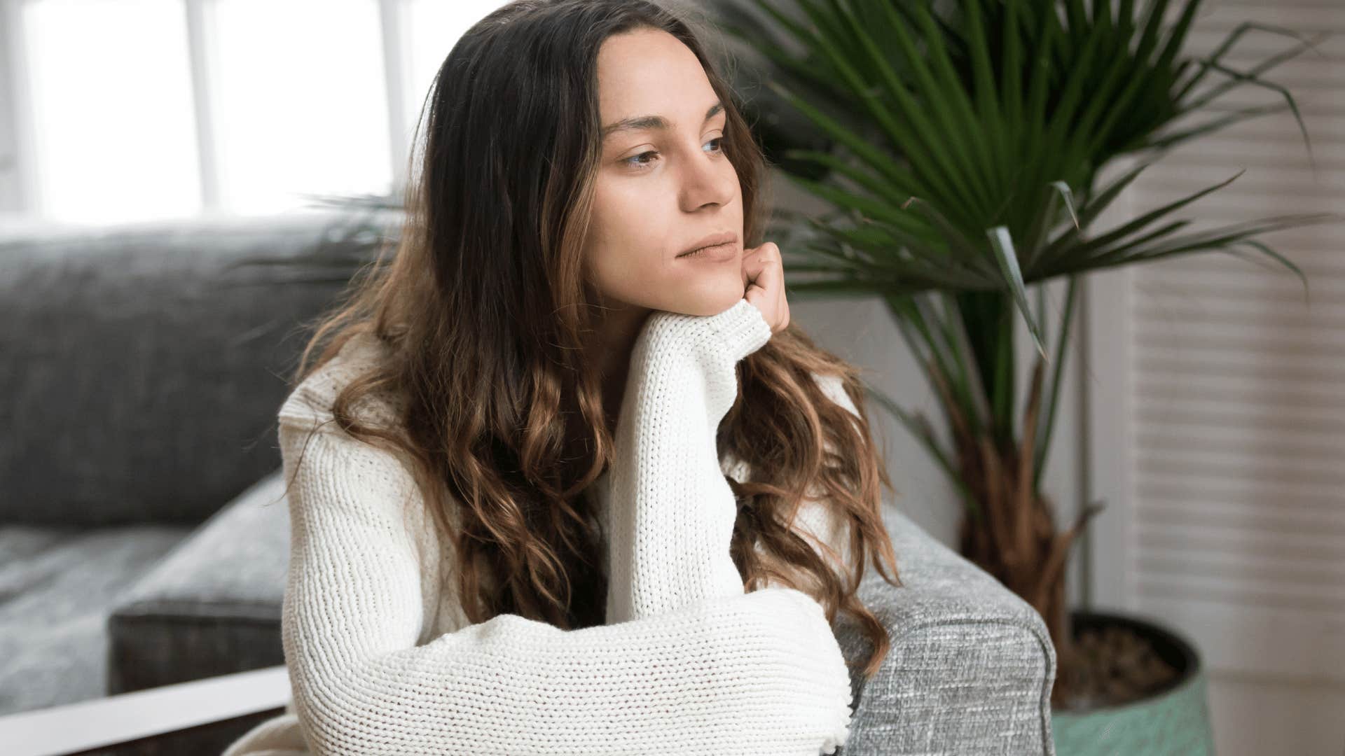 contemplative woman sitting alone