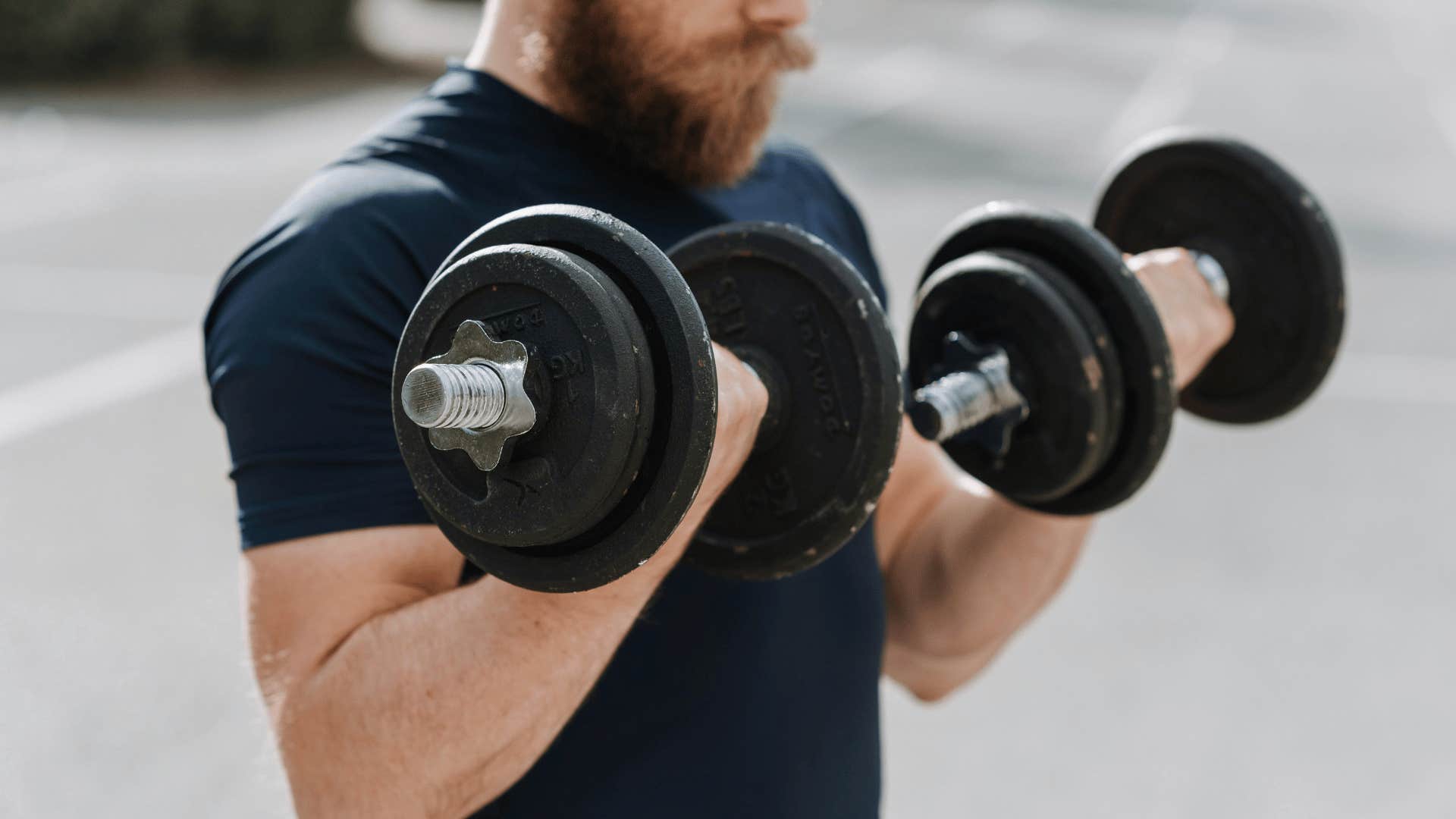 man lifting weights