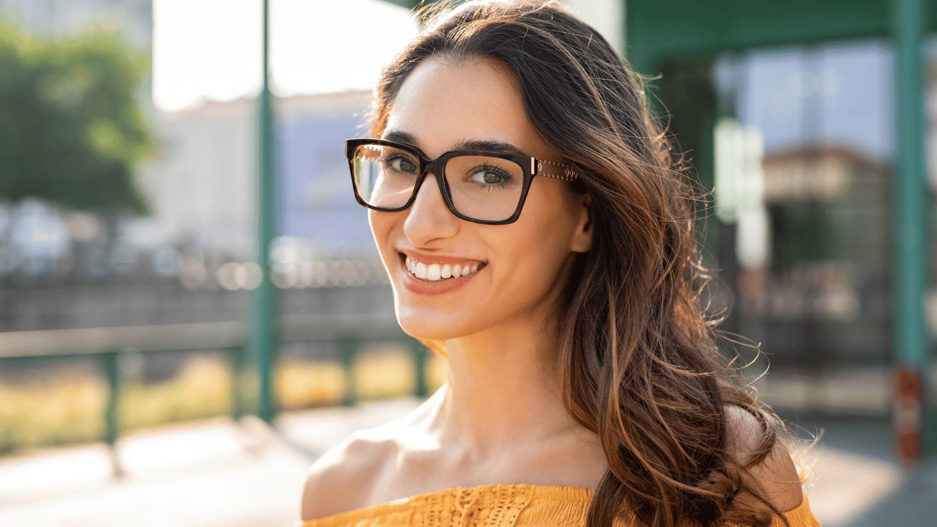 smiling young woman wearing glasses