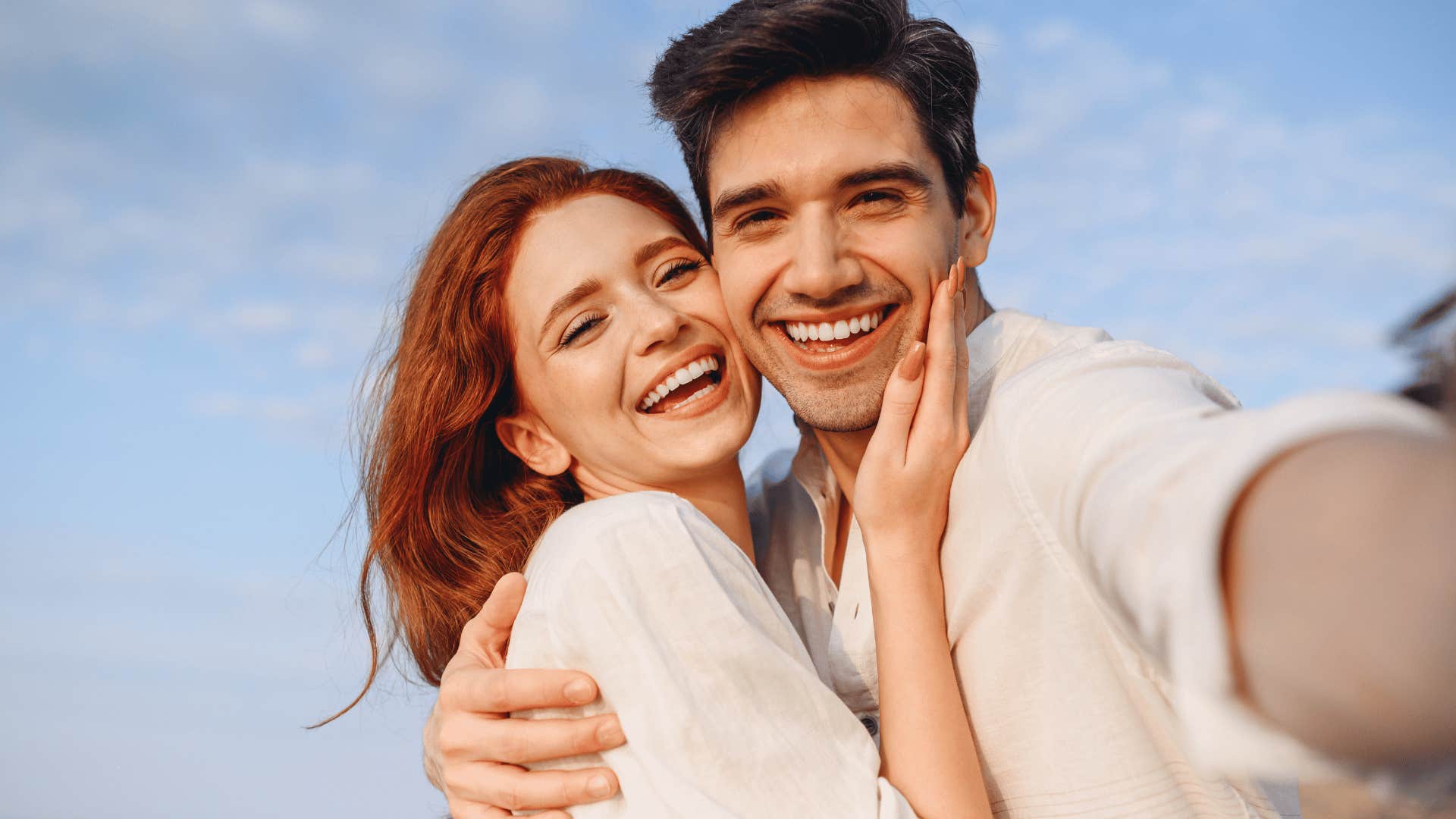 happy couple taking a selfie