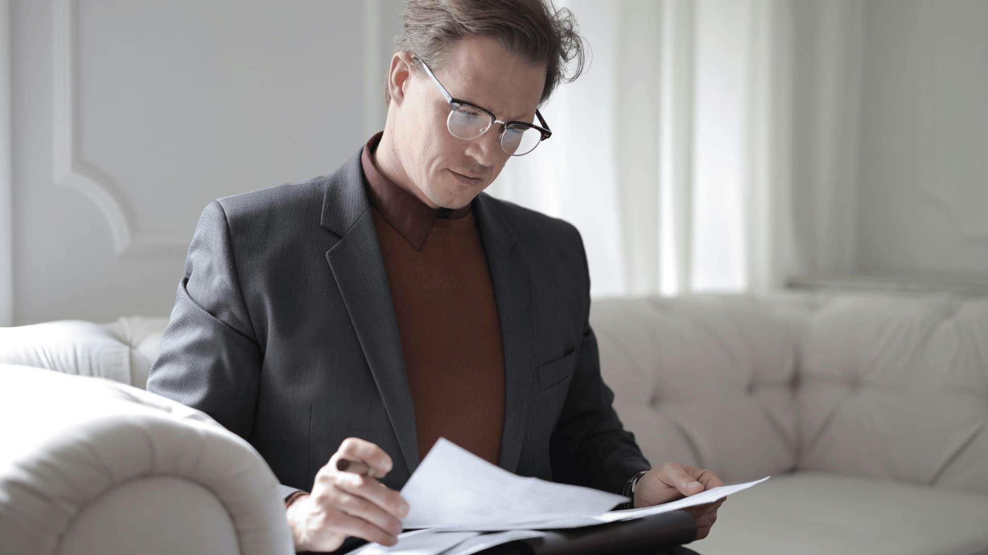 professional man looking through papers