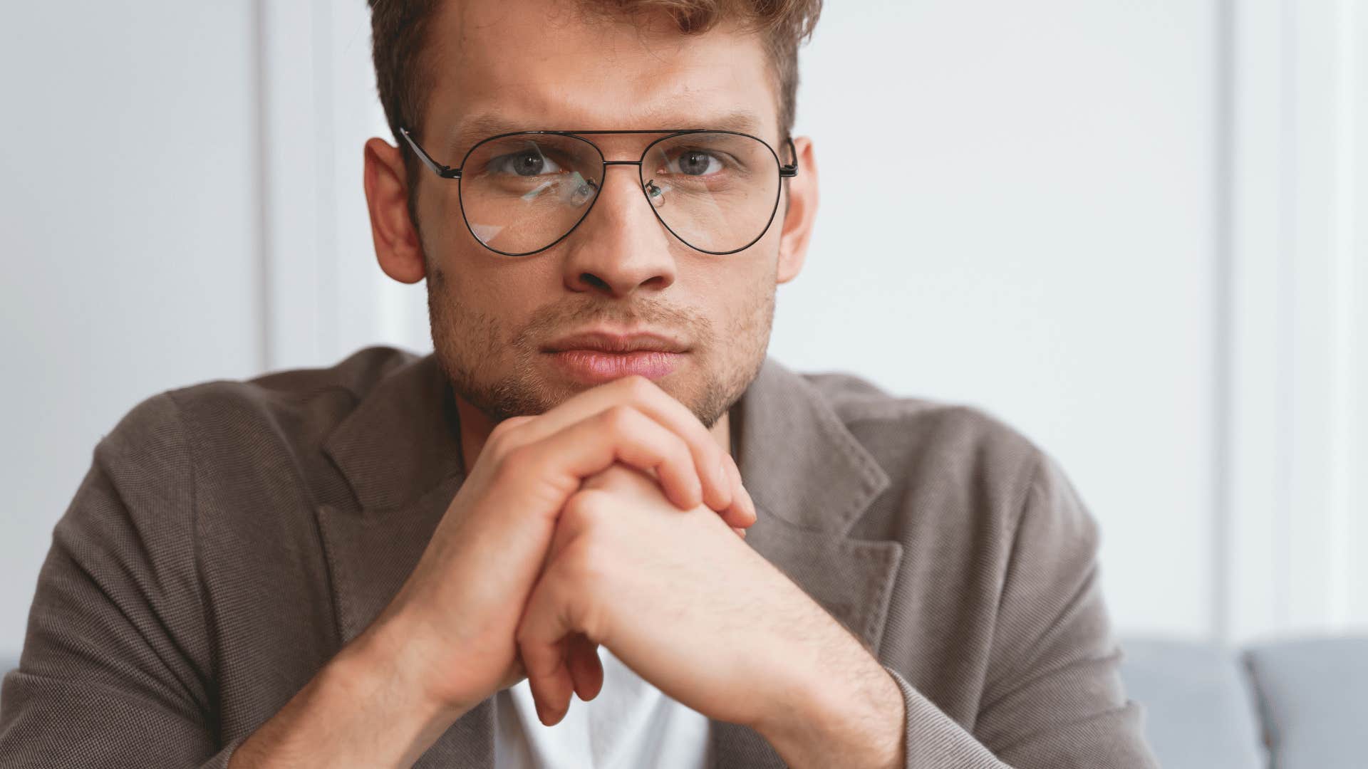 young man with a serious expression