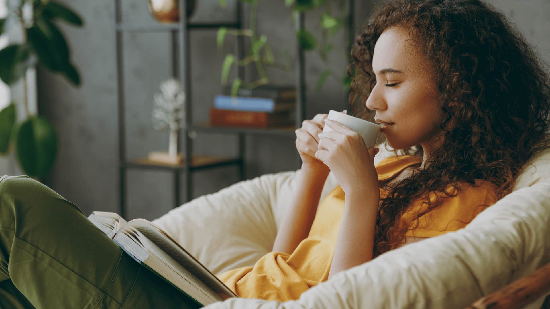 young woman drinking from mug