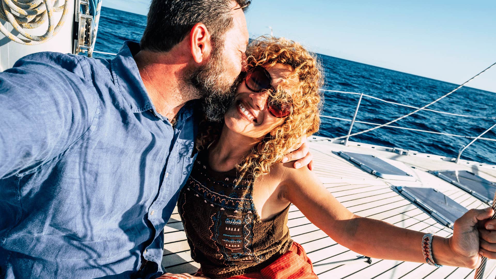 happy tourist couple on a boat