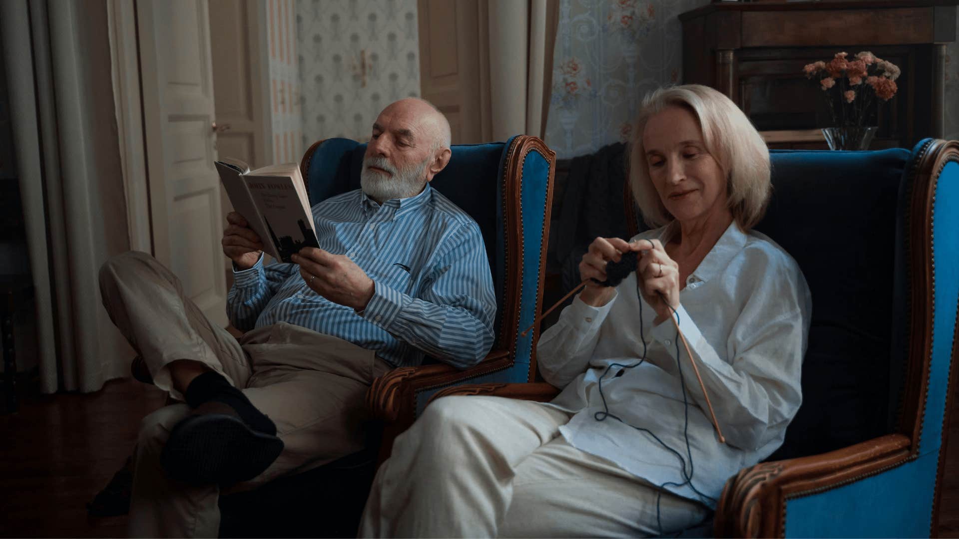 man reading and a woman knitting